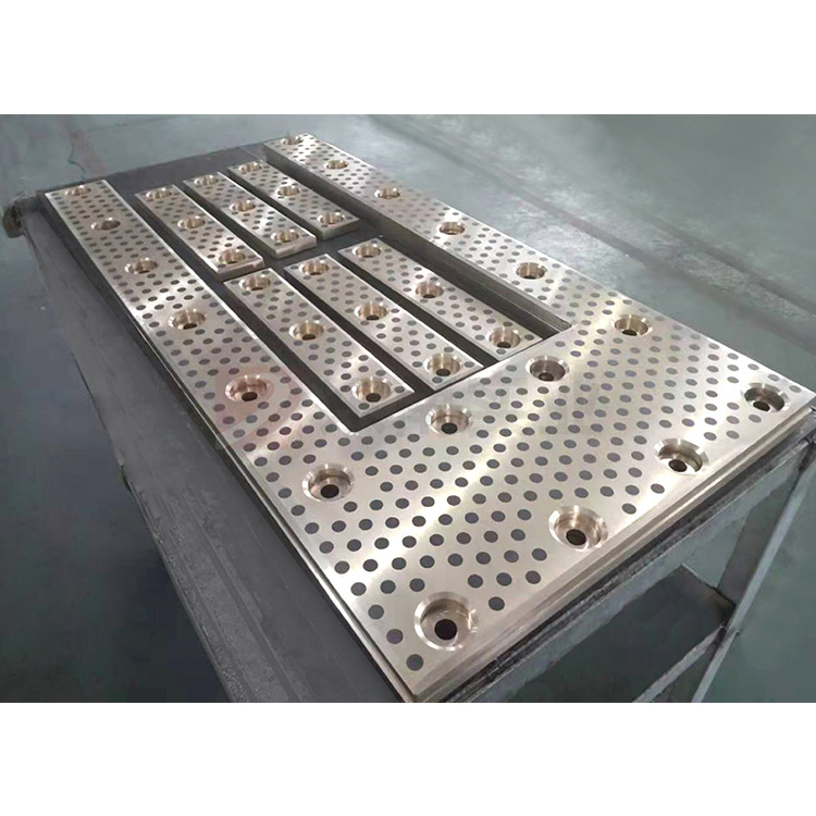 Self-lubricating wear-resistant plate